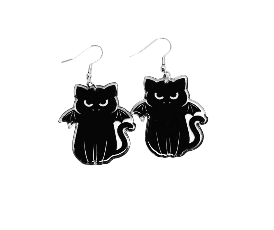Black cats dressed as bats earrings on a white background