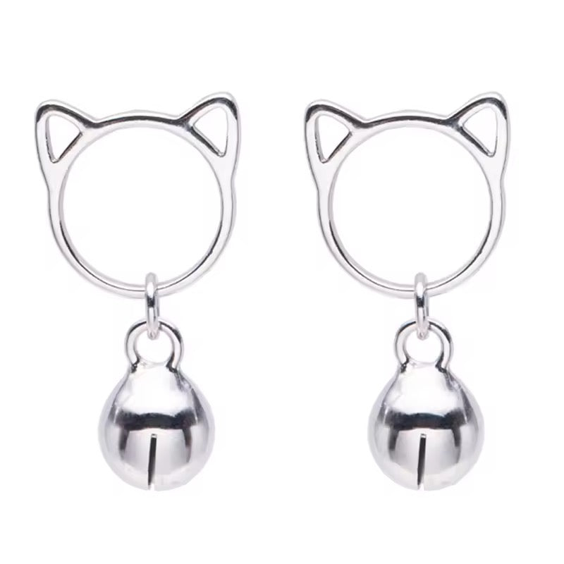 Silver cat-shaped earrings with bell charms on a white background