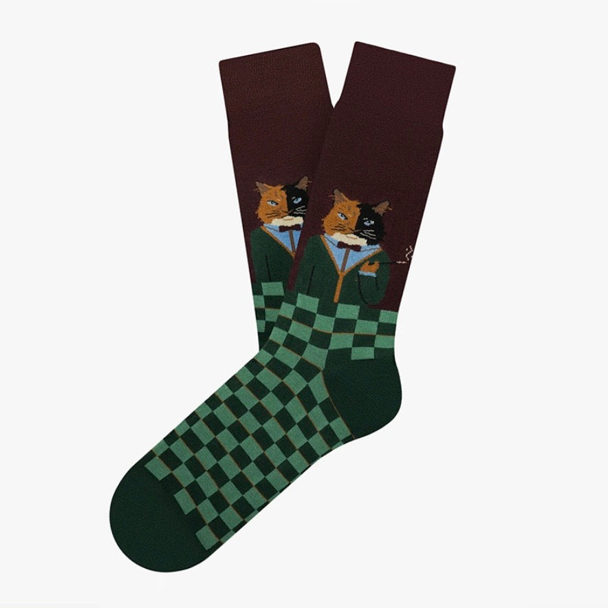 Socks with a design of a fox reading a book on a checkered background