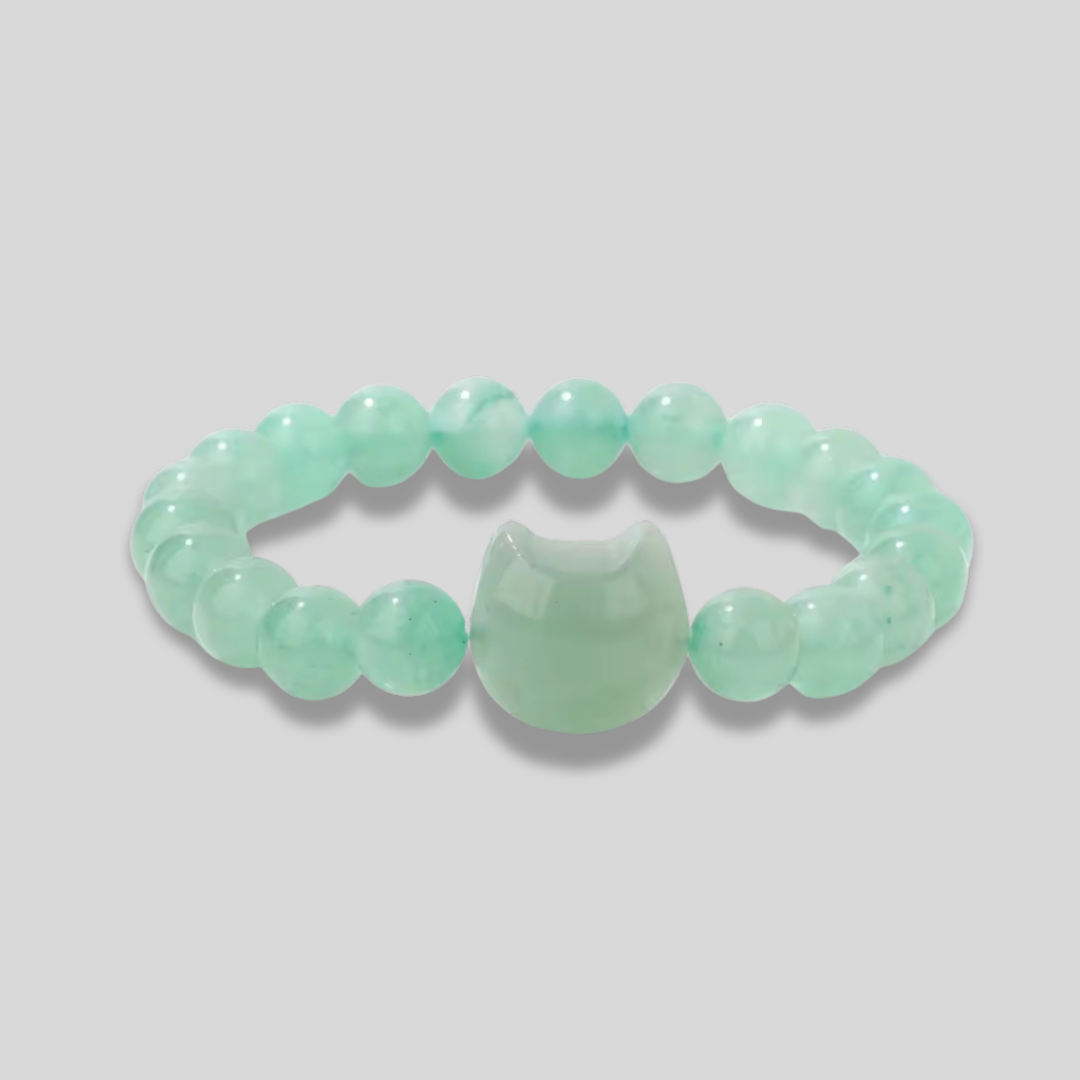 Natural stone Green Agate beaded bracelet with a cat head accent bead on a light gray background