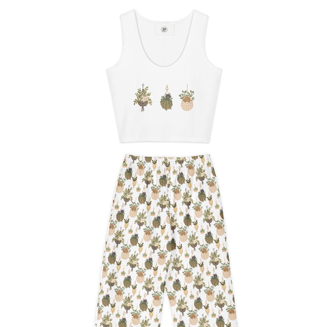 White tank top with printed design and floral pants on a white background