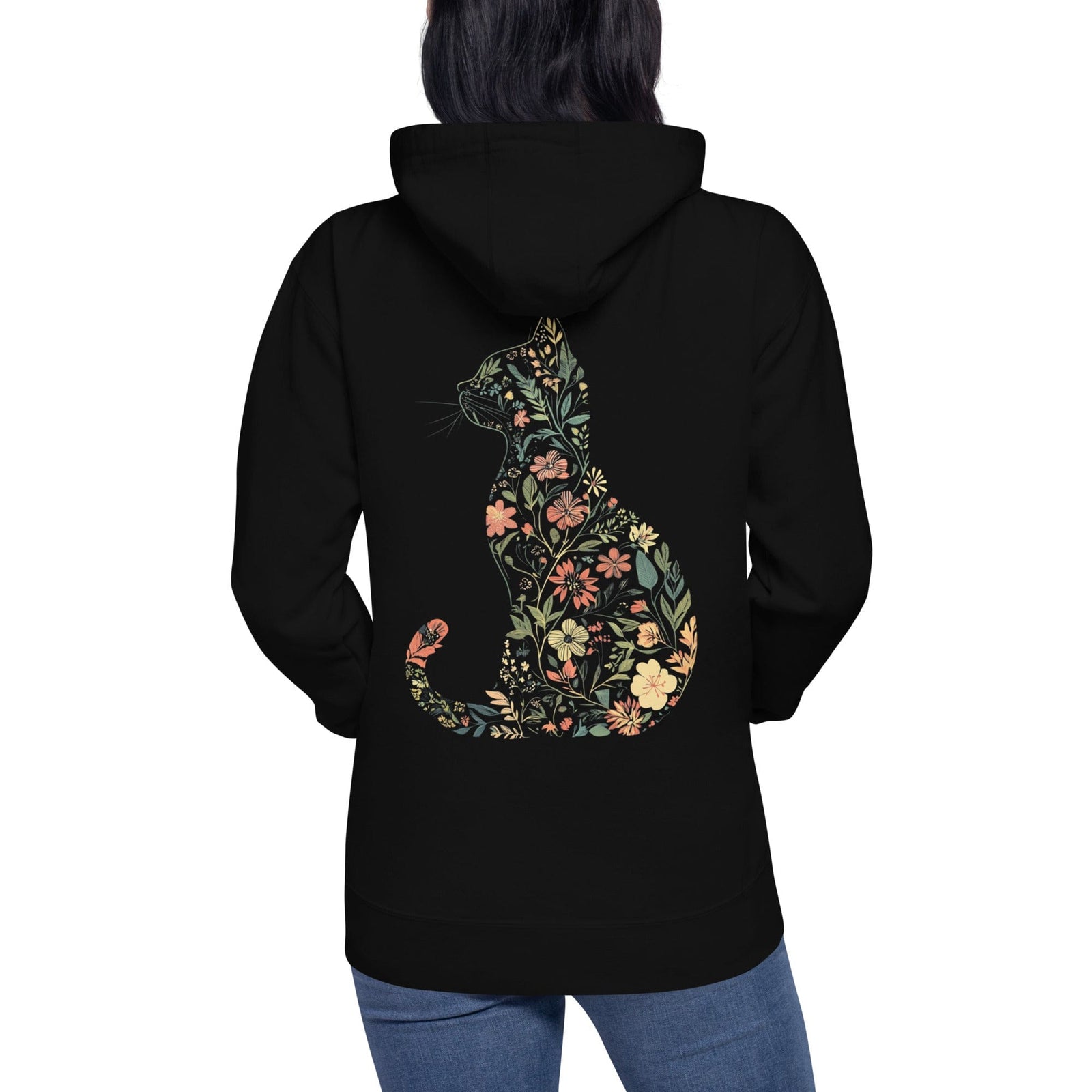 Person wearing black hoodie with floral silhouette of cat shaped design on back