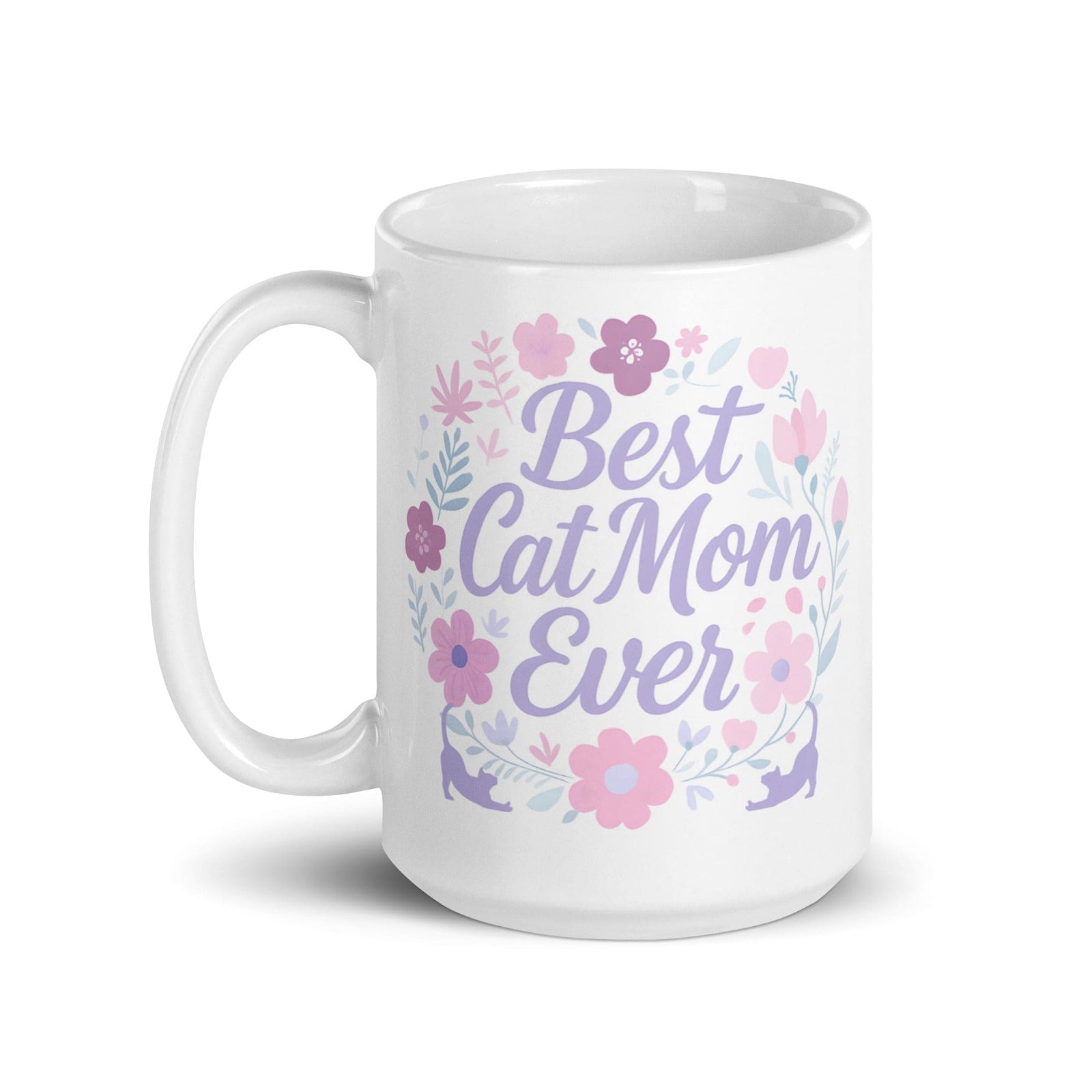 A white ceramic mug with pastel floral design and the text 'Best Cat Mom Ever'.