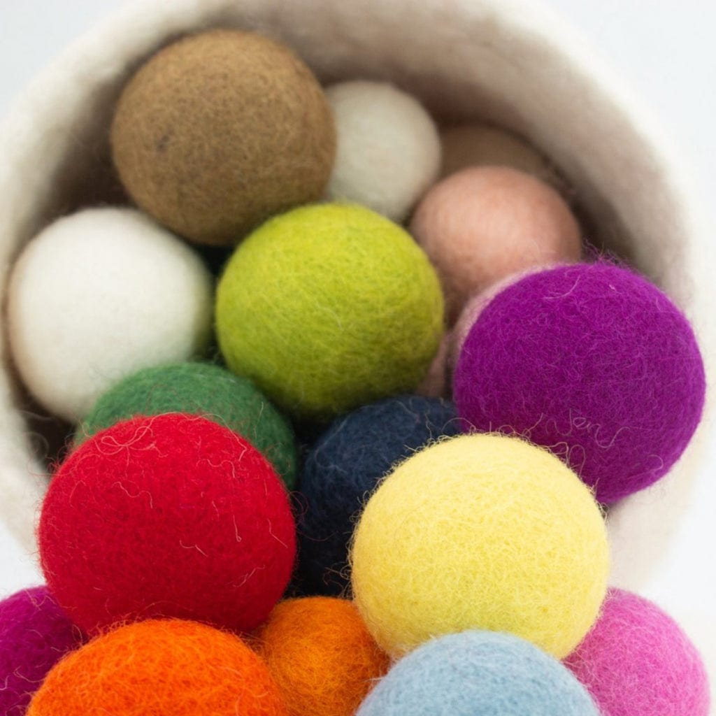 Closeup of colorful wool felt ball Cat Toys. Natural wool balls are eco-friendly and perfect texture for kitty.