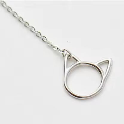 Silver cat ear necklace on a white background