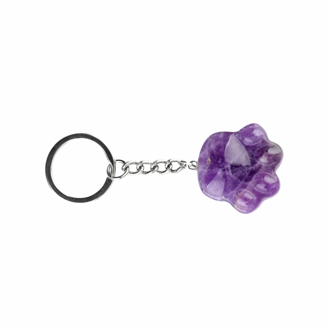 A purple amethyst paw-shaped keychain with a silver metal chain and a black split key ring, shown on a plain white background.