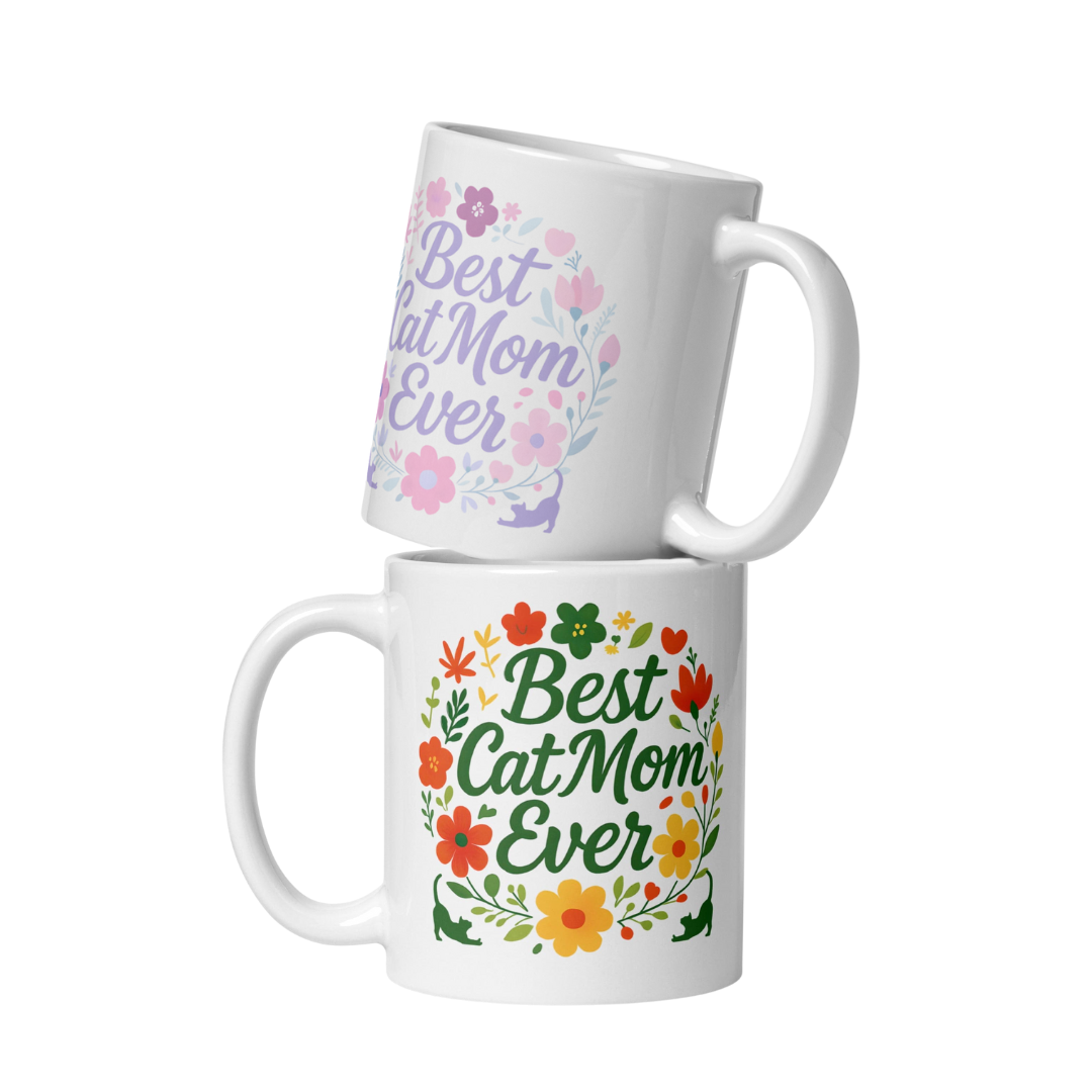 Two white mugs with &#39;Best Cat Mom Ever&#39; text and floral designs on a white background