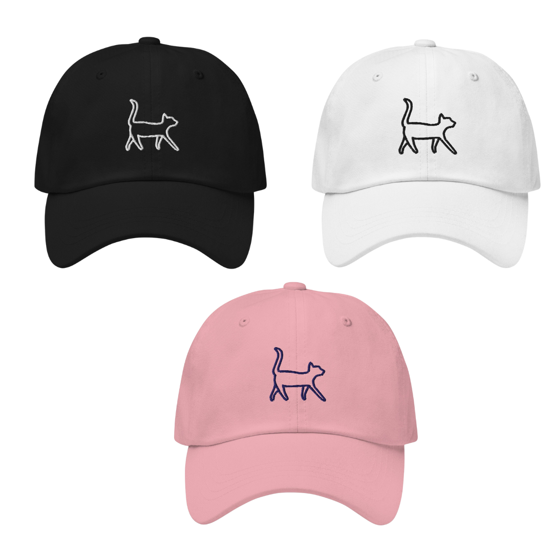 Three baseball caps in black, white, and pink with cat illustrations on a white background