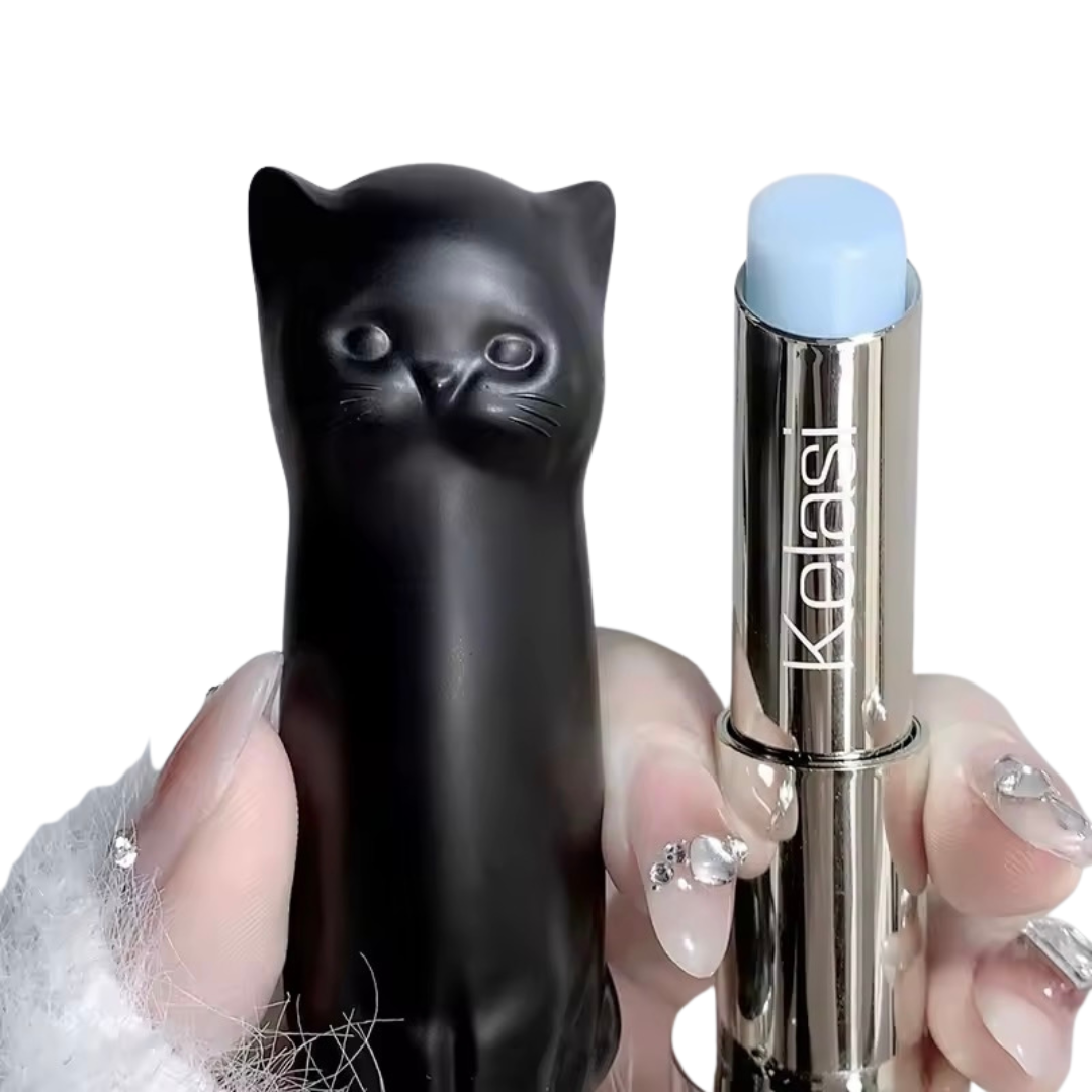 Black cat-shaped lip balm held in one hand
