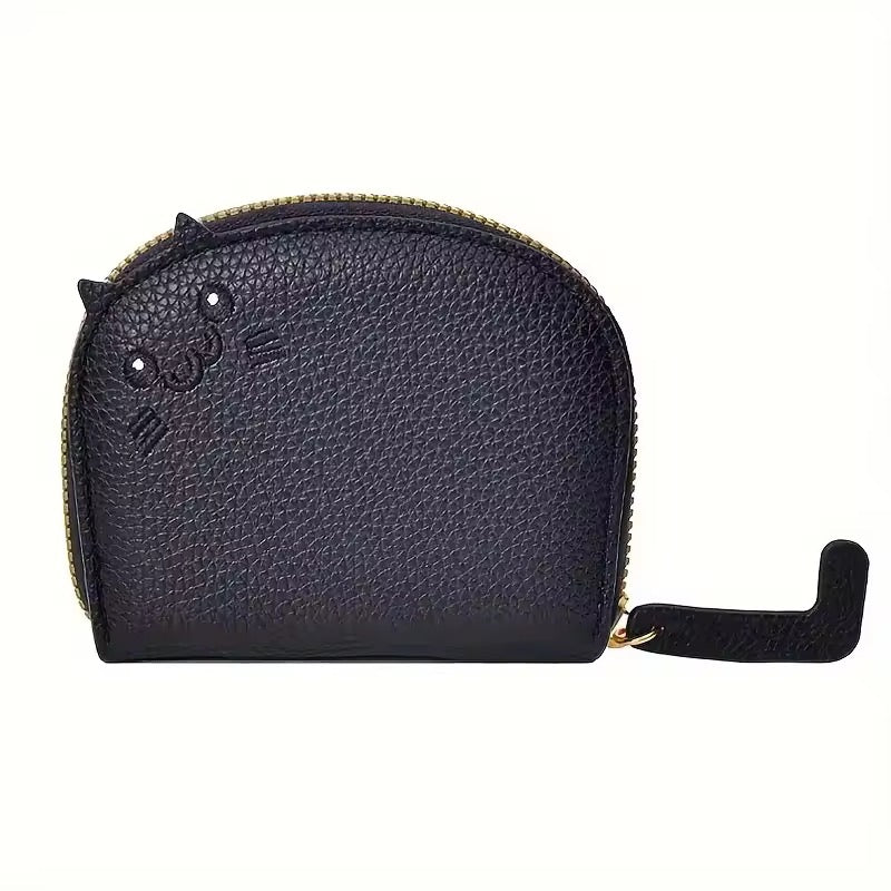 Black textured card or coin wallet shaped like a cat with ears that poke up and embroidered face with a zipper on a white background
