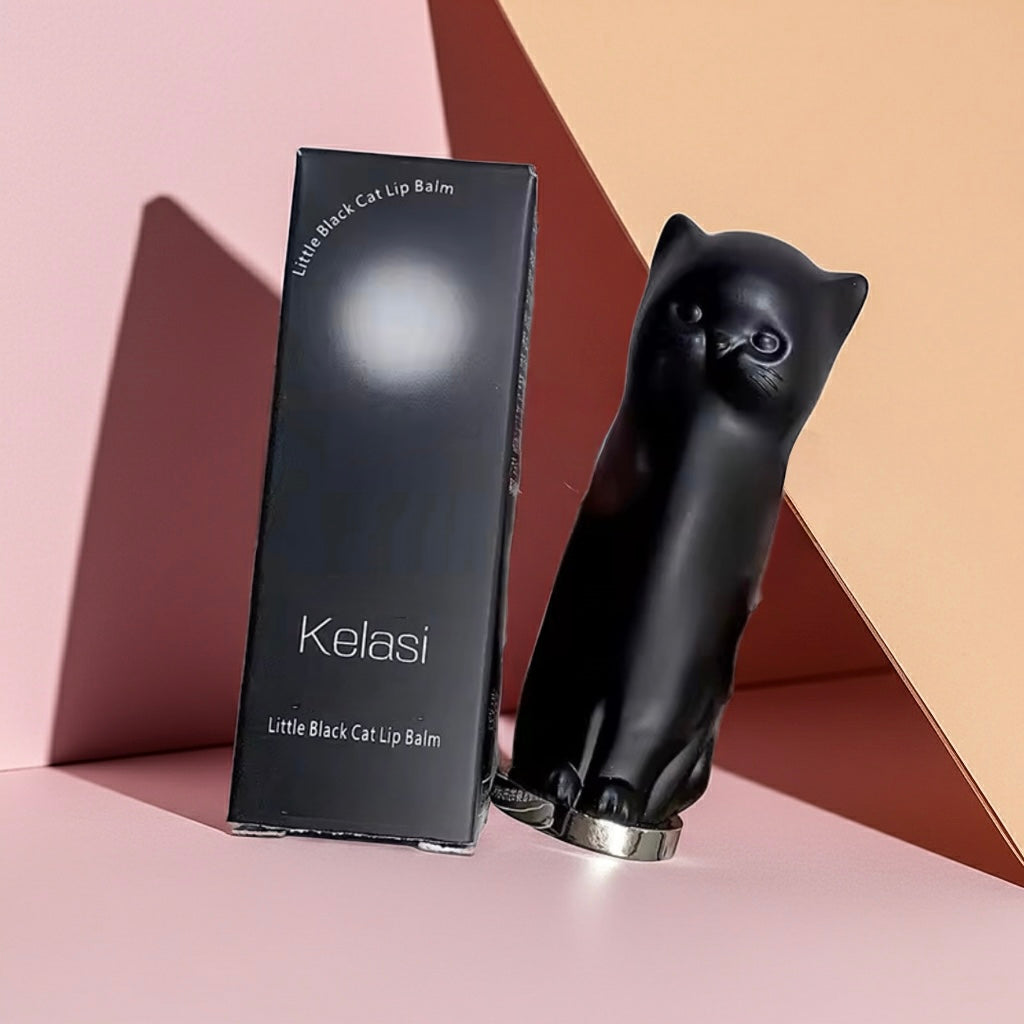 Black cat-shaped lip balm and packaging with 'Kelasi' branding on a geometric background