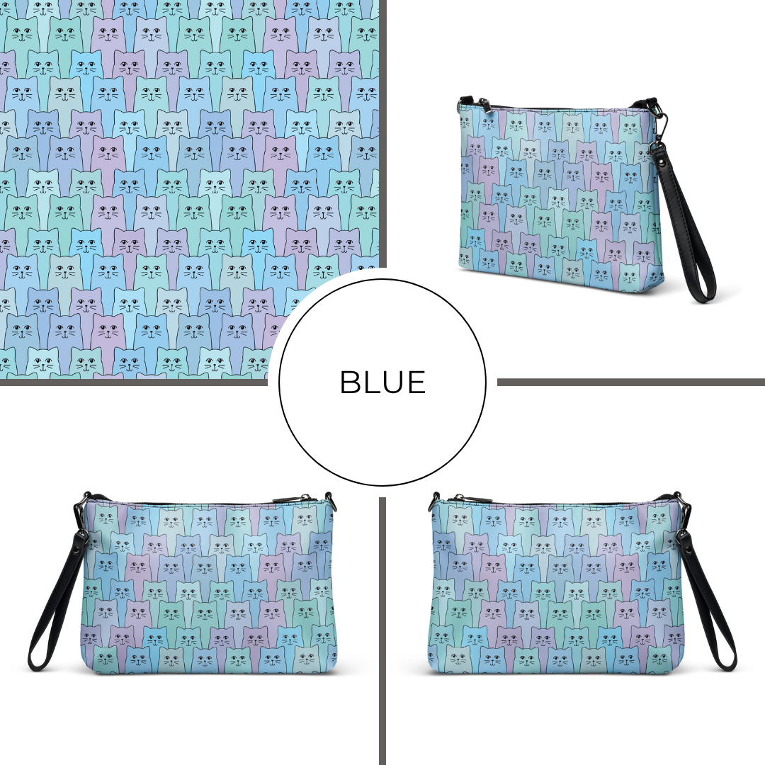 Blue patterned crossbody bag with cat design on a white background