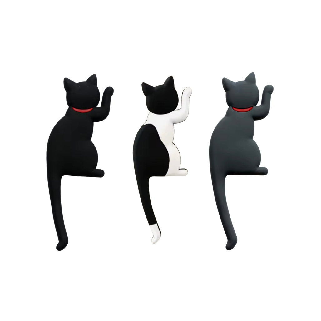 Three cat-shaped wall hooks in black, white, and gray on a white background