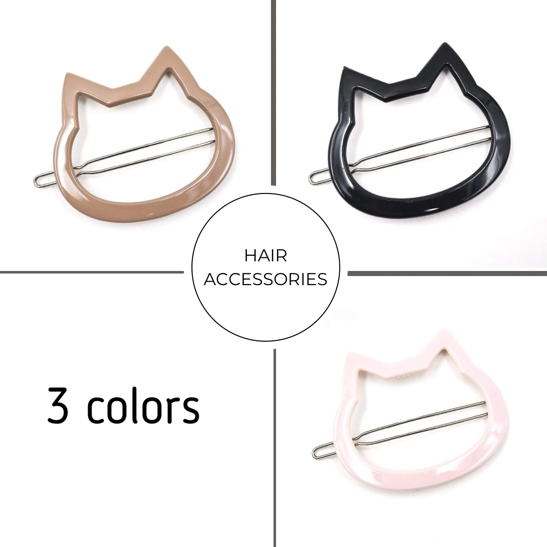 Cat-shaped hair accessories in three colors on a white background