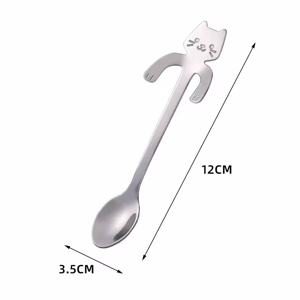 Cat-shaped spoon with measurements on a white background. 