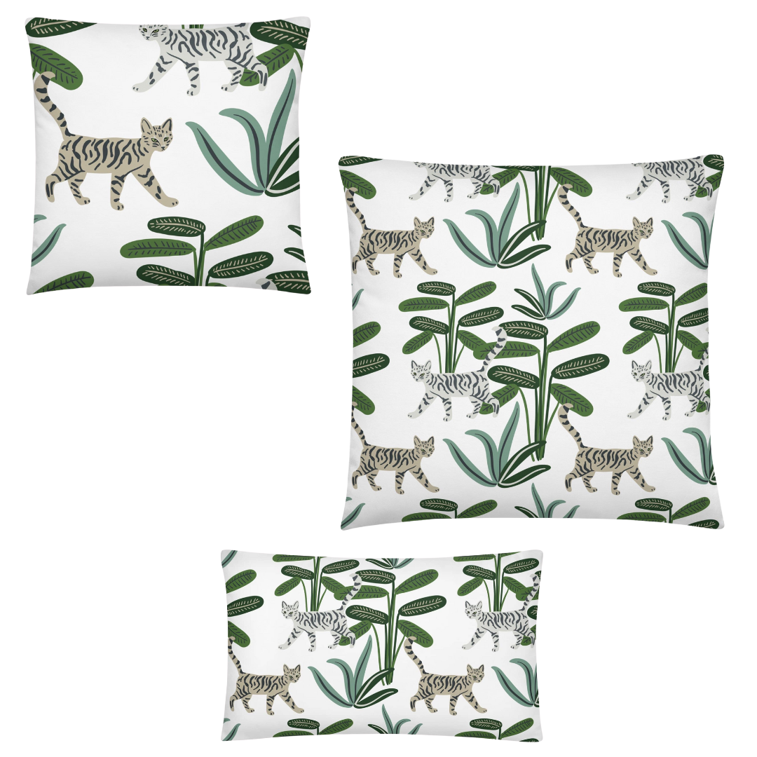 Set of three pillows with cat and plant pattern on a white background