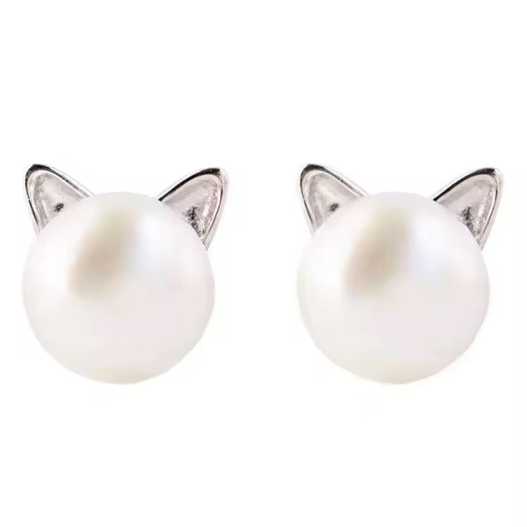 Pearl cat ear-shaped earrings on a white background