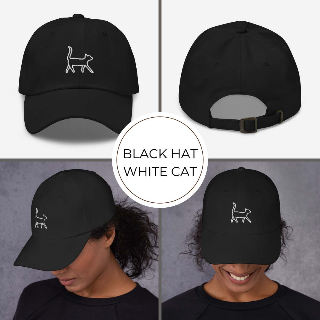 Black cap with white cat logo worn by a person on a gray background