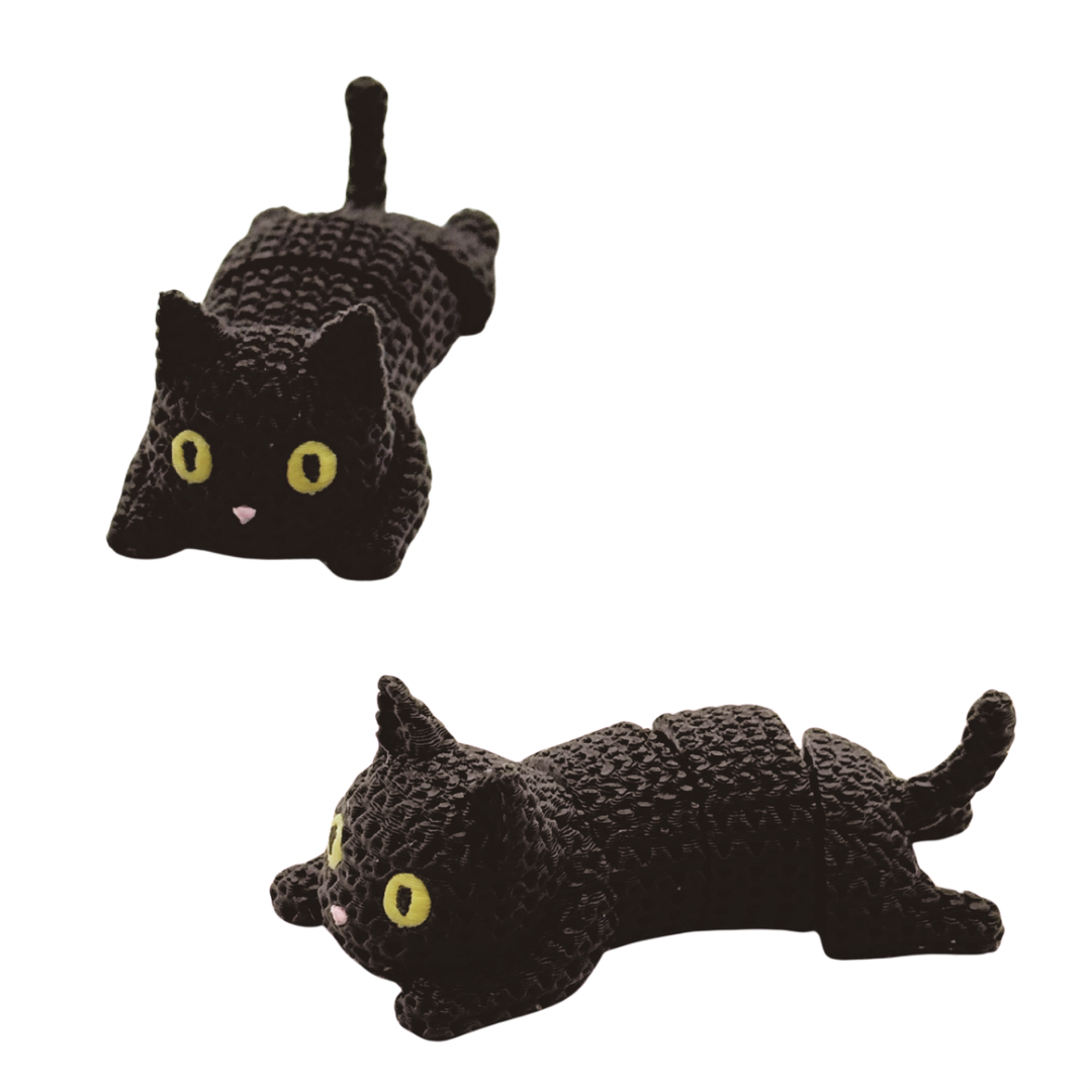 Two black cat-shaped fidget desk toys with yellow eyes on a white background