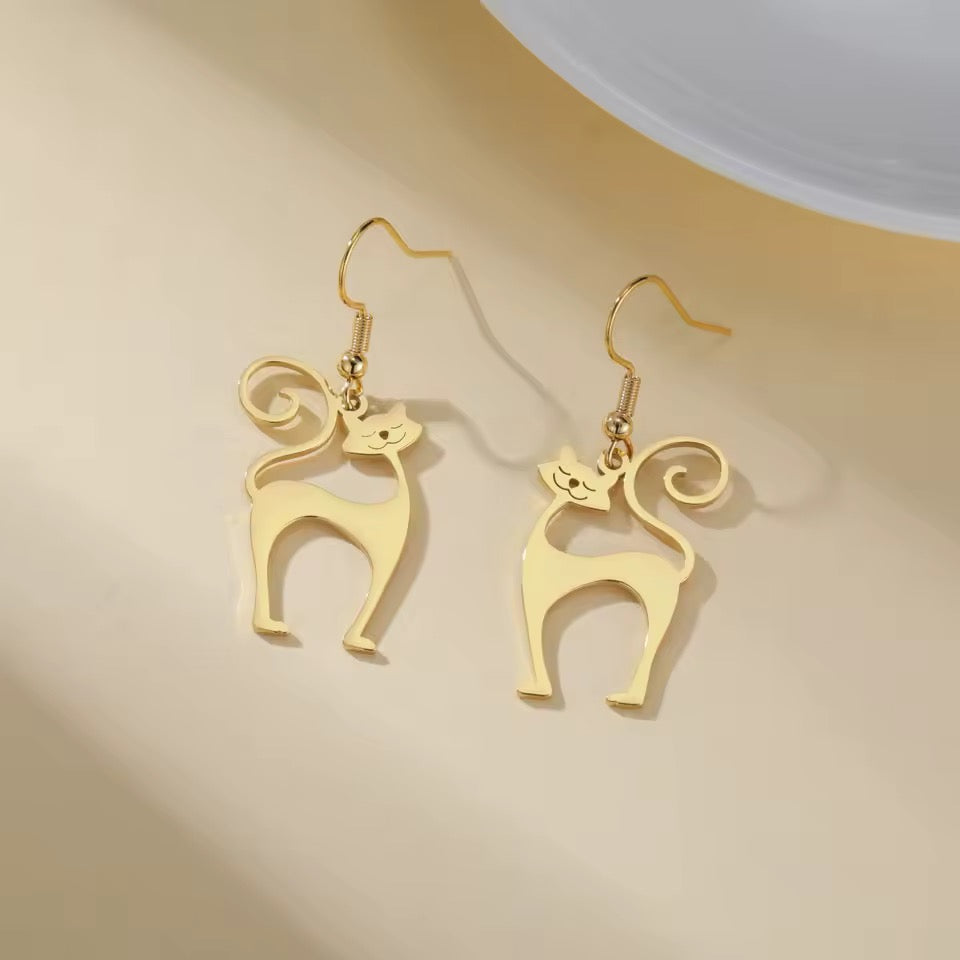 Groovy 1960s stylized cat earrings in gold tone on french ear wires