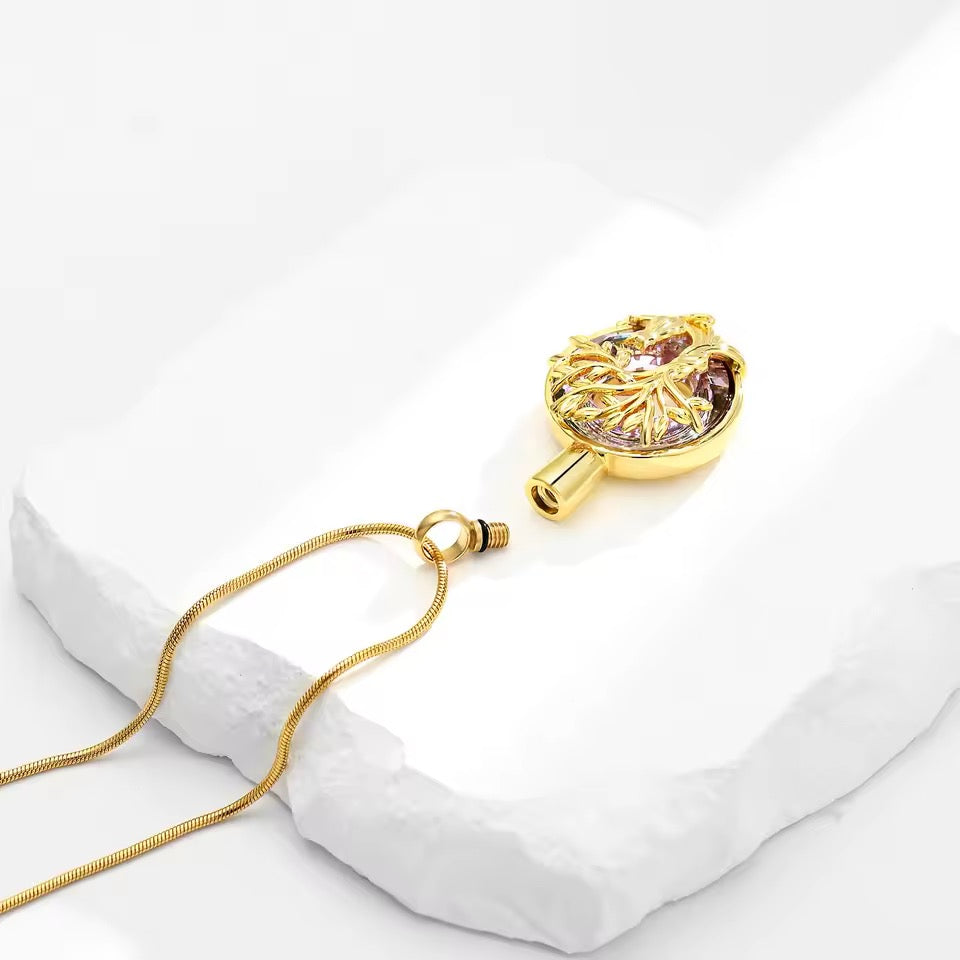 Gold necklace with a cat-shaped pendant on a white background