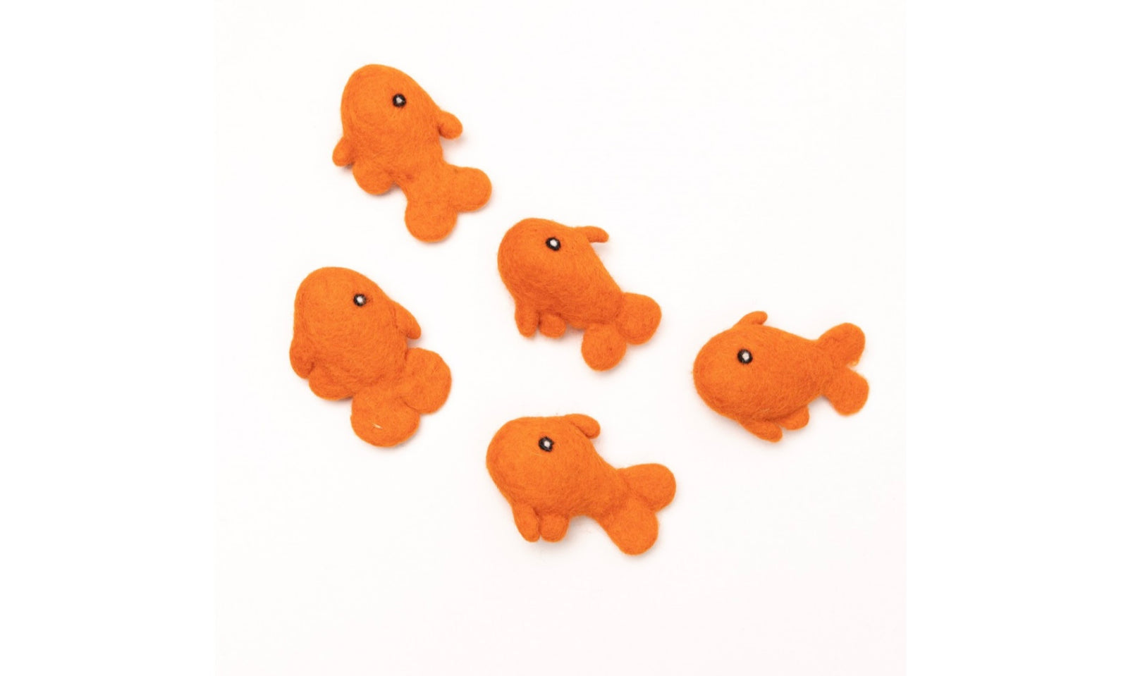 Five handmade orange wool felt goldfish eco-friendly Cat Toys look like they’re swimming in a school.