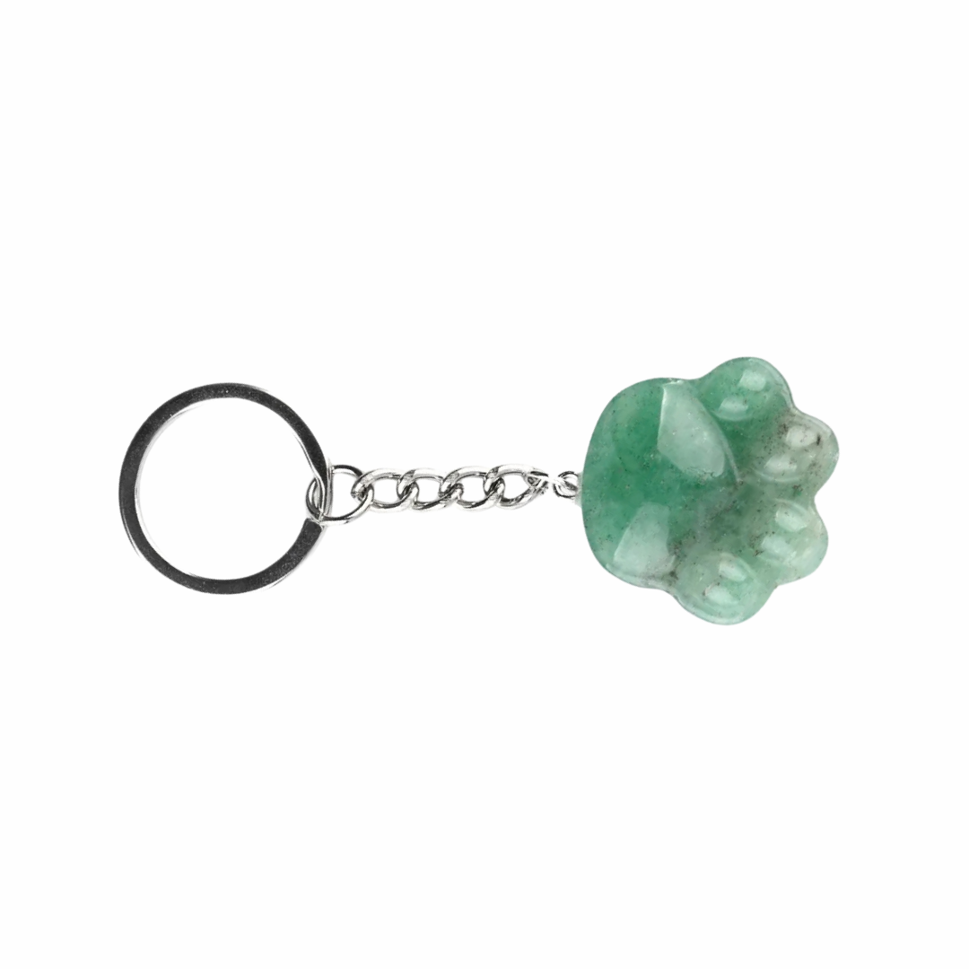 A green paw-shaped crystal keychain with a silver-tone chain and black split ring, shown on a plain white background.