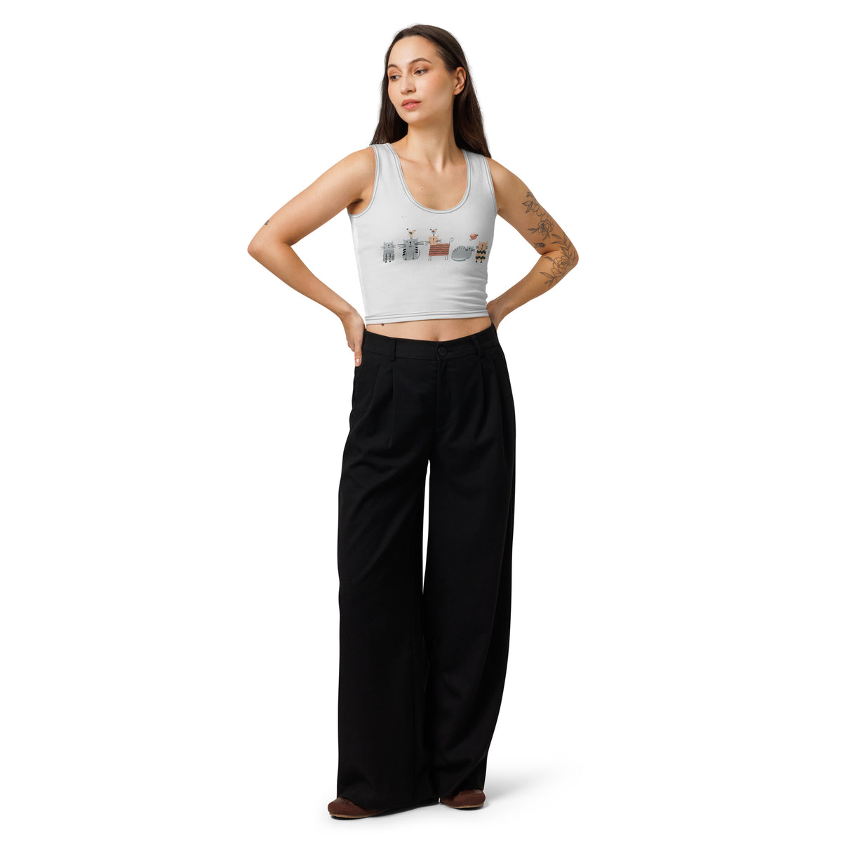Woman wearing a grey tank top with Square Cats design and black wide-leg pants on a white background