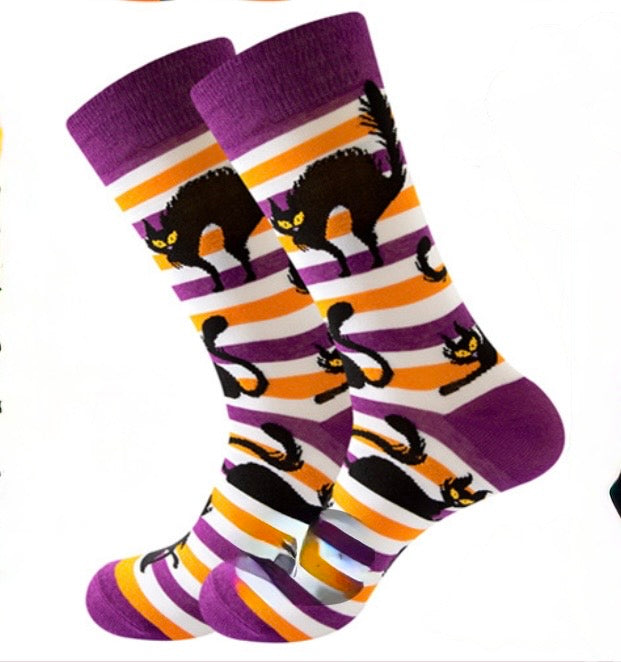 Pair of striped socks with black cat design