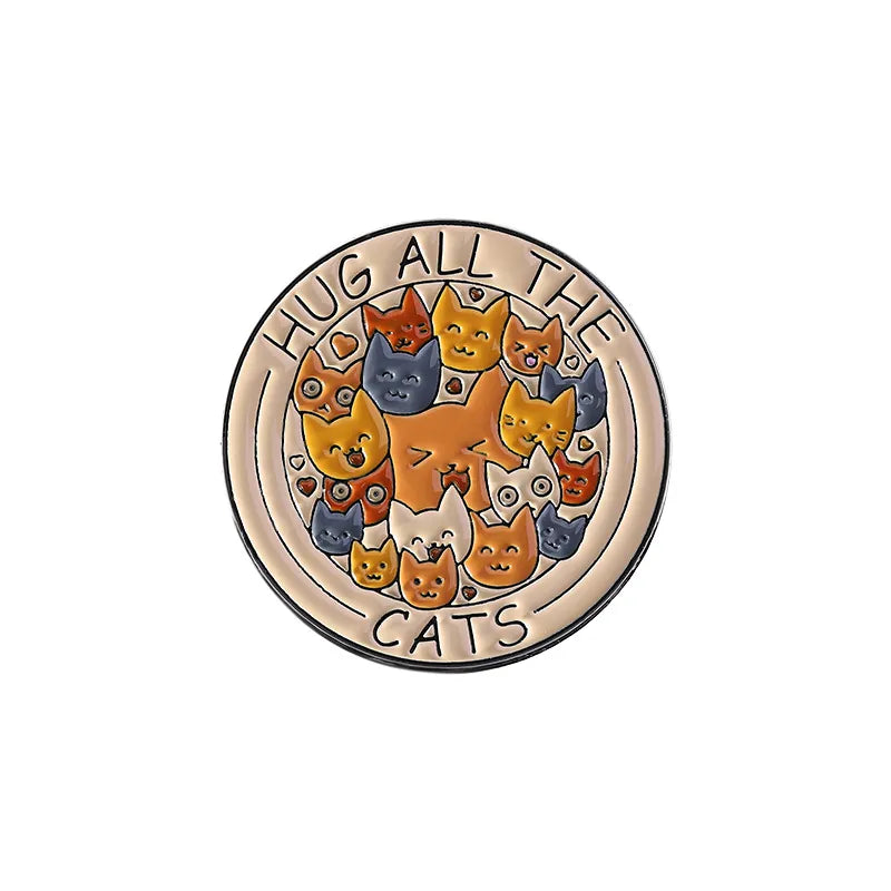 Circular badge with cartoon cats and 'Hug All The Cats' text on a white background