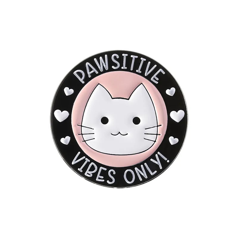Circular badge with a cat illustration and text 'PAWSITIVE VIBES ONLY!' on a white background