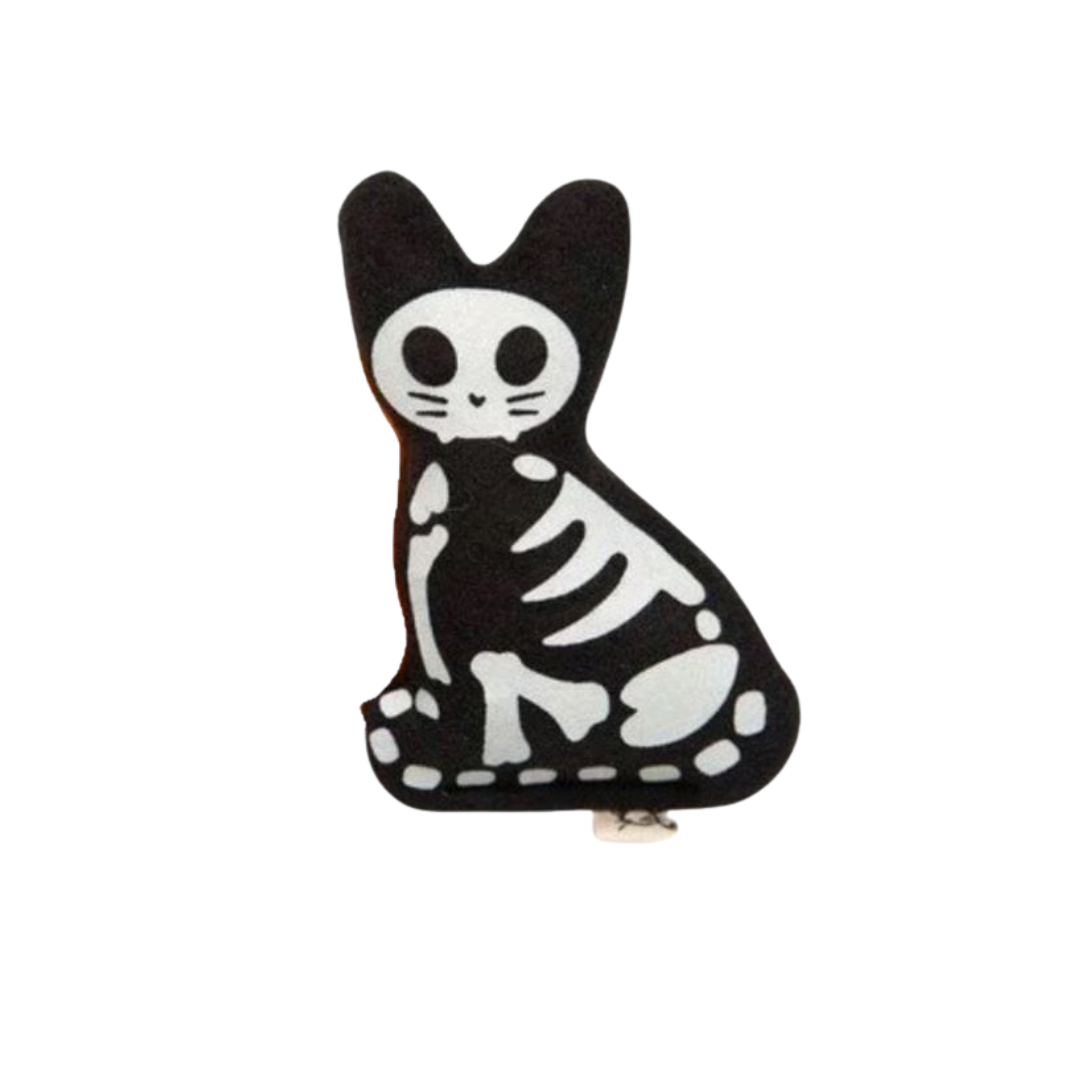 Black and white skeleton cat plush on a white background
