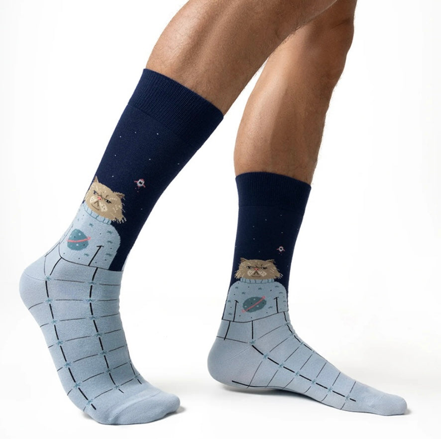 Navy and light blue socks with space-themed designs on a white background