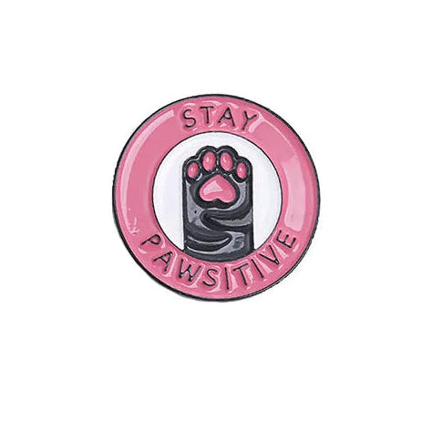 Pink circular badge with paw print and 'Stay Pawsitive' text on a white background