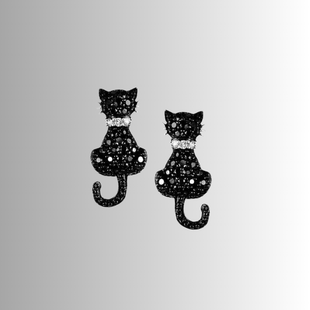 Black cat-shaped earrings with sparkling details on a light gray background