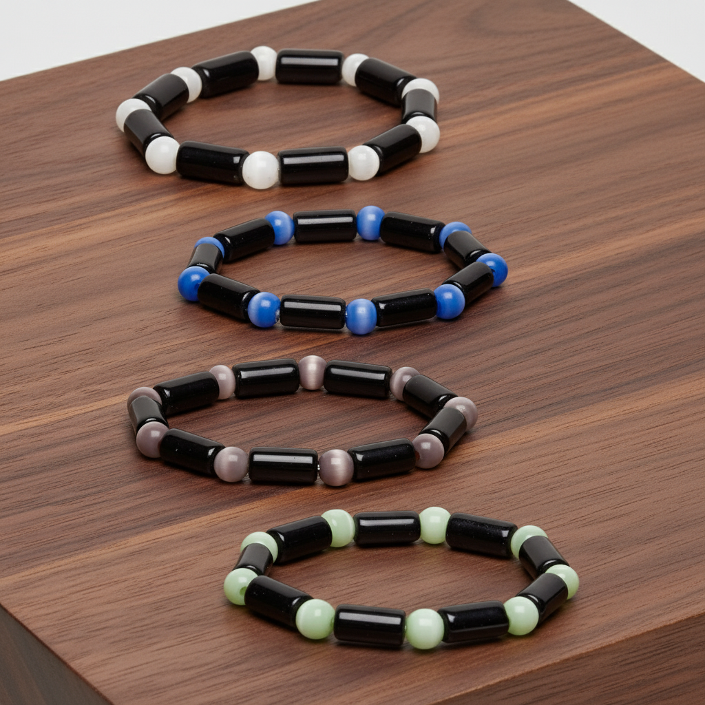 Set of colorful beaded cats eye glass bead bracelets on a wooden surface