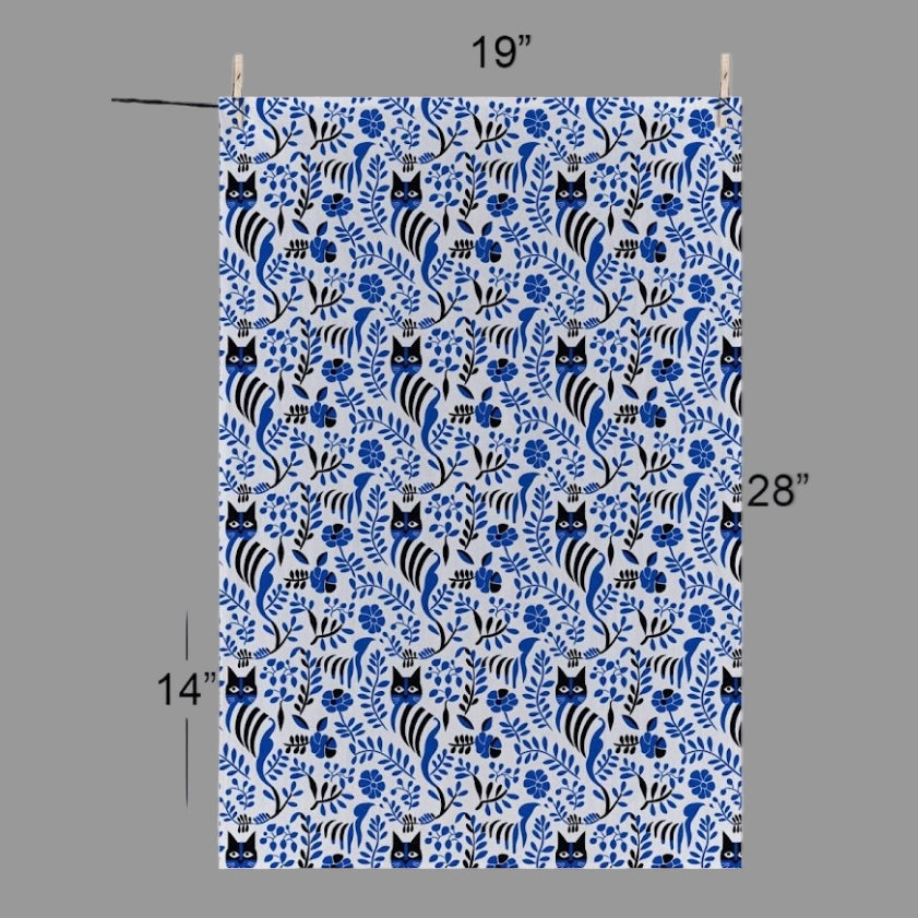 Black cats hide out amongst the charming Norwegian blue and black print on this Cat Tea Towel 