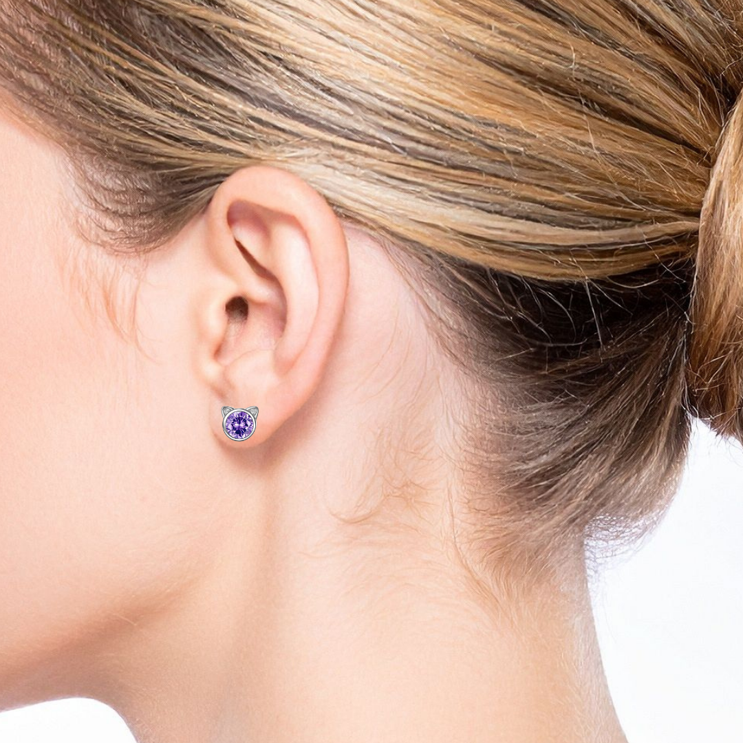 Close-up of an ear wearing a purple crystal stud Cat Earring 