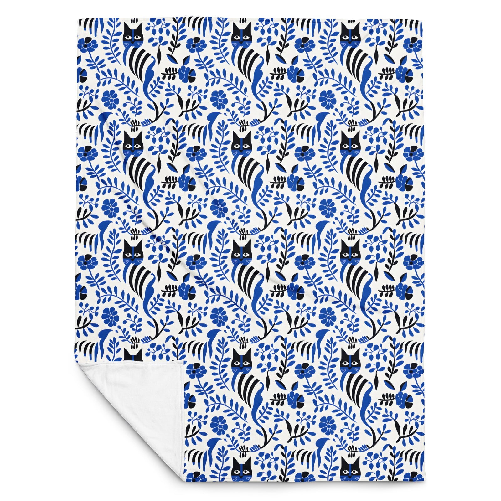 Patterned fleece blanket with norwegian style pattern featuring black and white cats and blue flowers on a white background