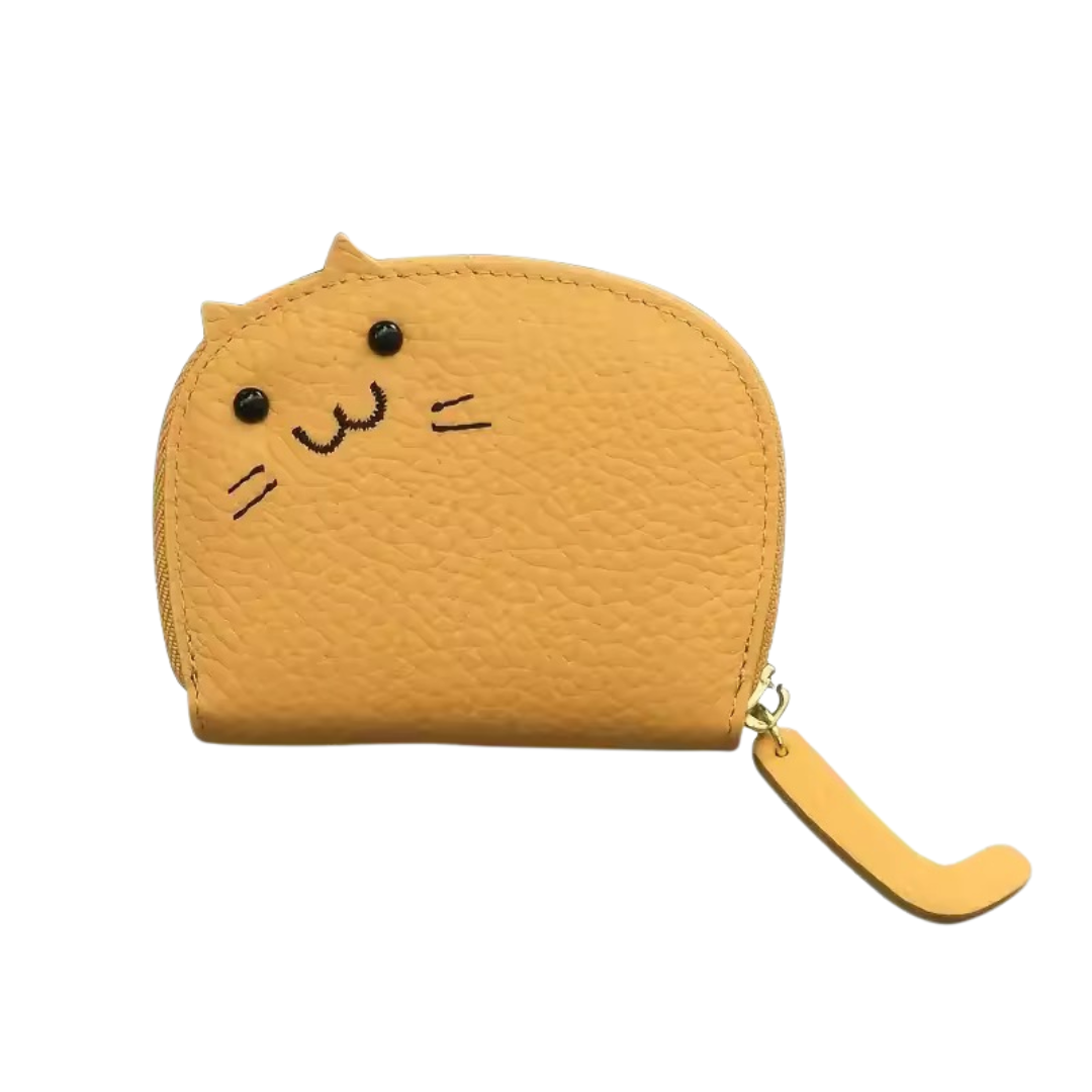 Yellow textured card or coin wallet shaped like a cat with ears that poke up and embroidered face with a zipper on a white background