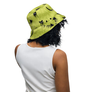 Curious Black Cat Reversible Bucket Hat on female model