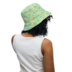 Cat-themed Reversible Bucket Hat | Happy Cat Green. on model