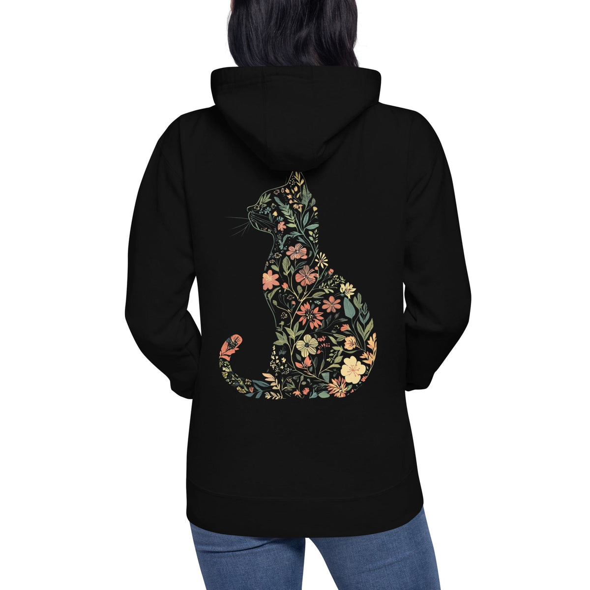 Person wearing black hoodie with floral silhouette of cat shaped design on back 