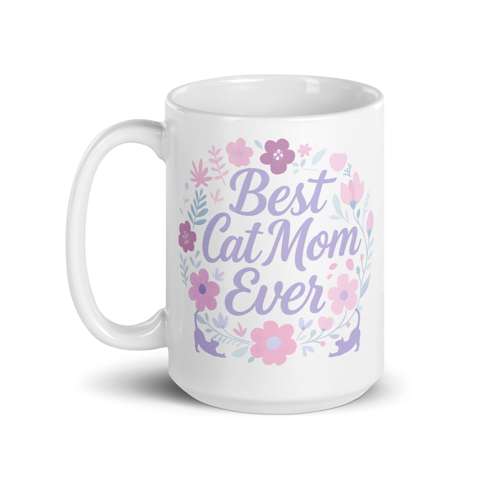 A white ceramic mug with pastel floral design and the text 'Best Cat Mom Ever'.