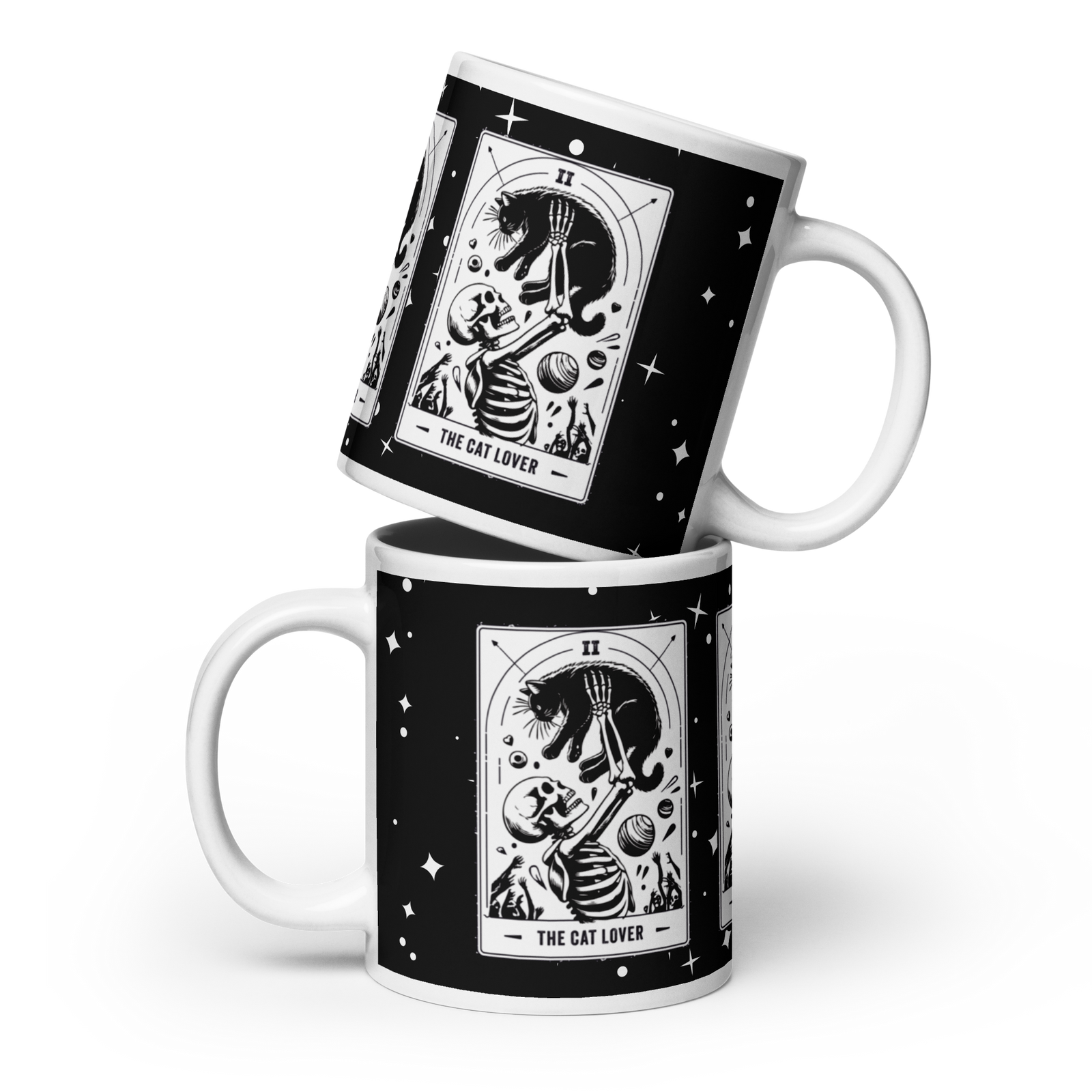 Two stacked ceramic mugs with a black and white tarot card design featuring a skeleton and a cat, labeled 'THE CAT LOVER'.